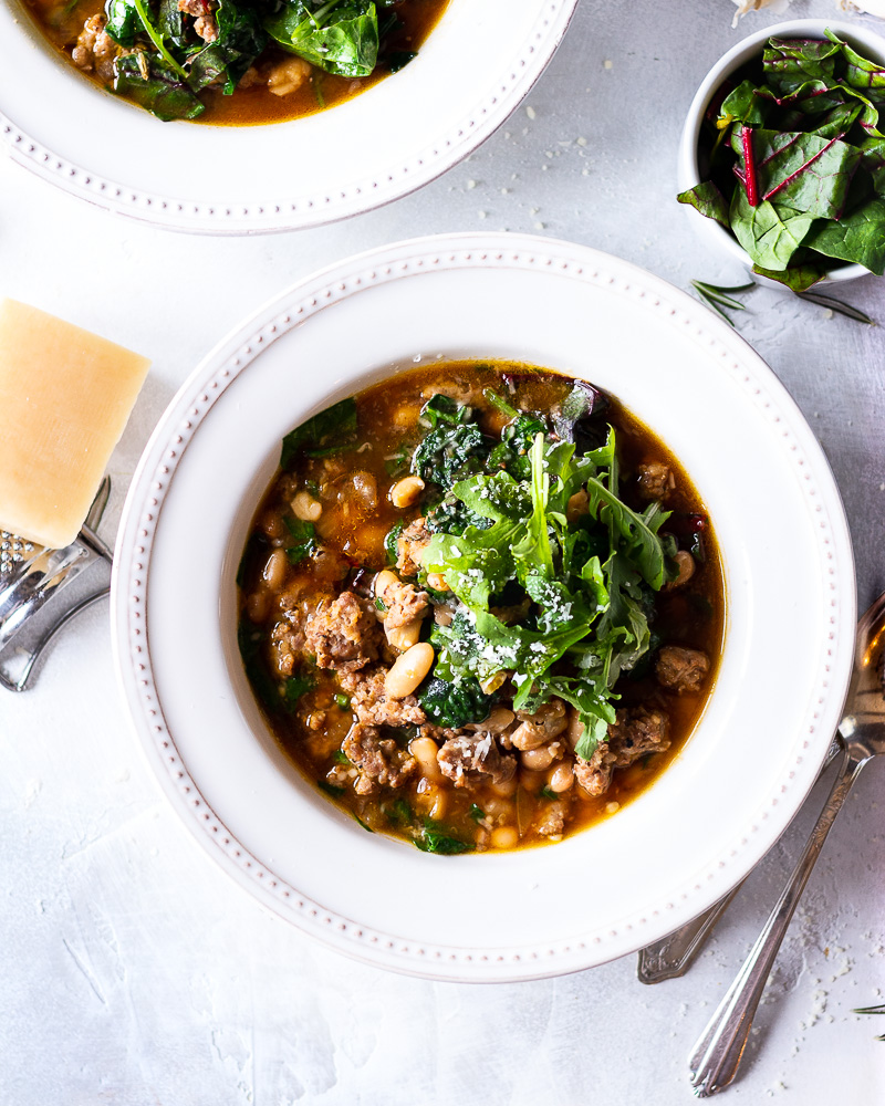 White Bean Chicken Sausage Soup with Wilted Greens